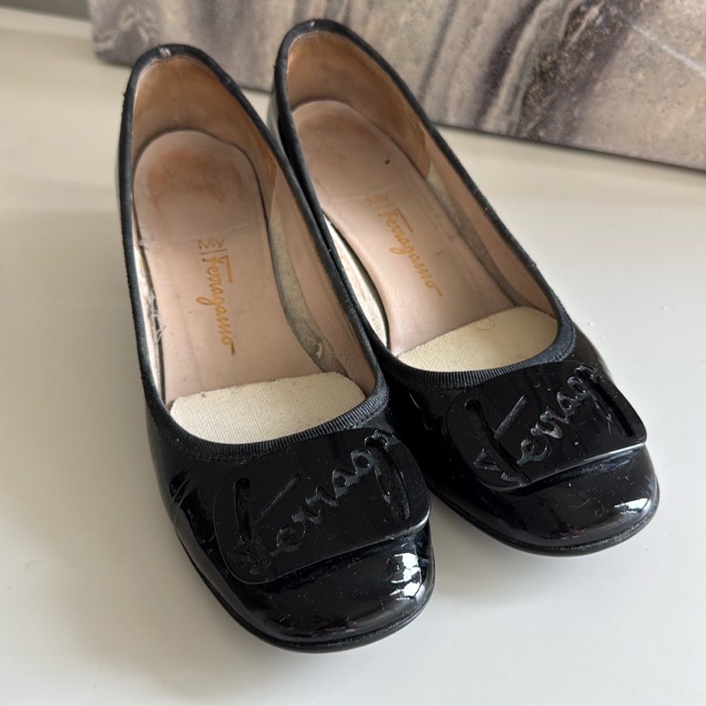 Black patent Ferragamo pumps -
